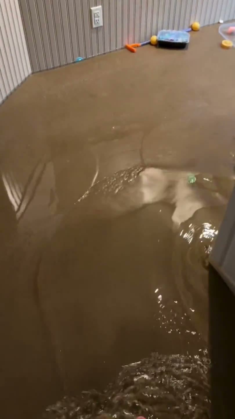 Flooded room with murky water covering the floor